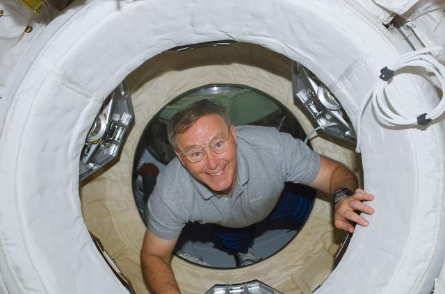 NASA image: Ross drifts through the ODS hatch to the ISS during STS-110