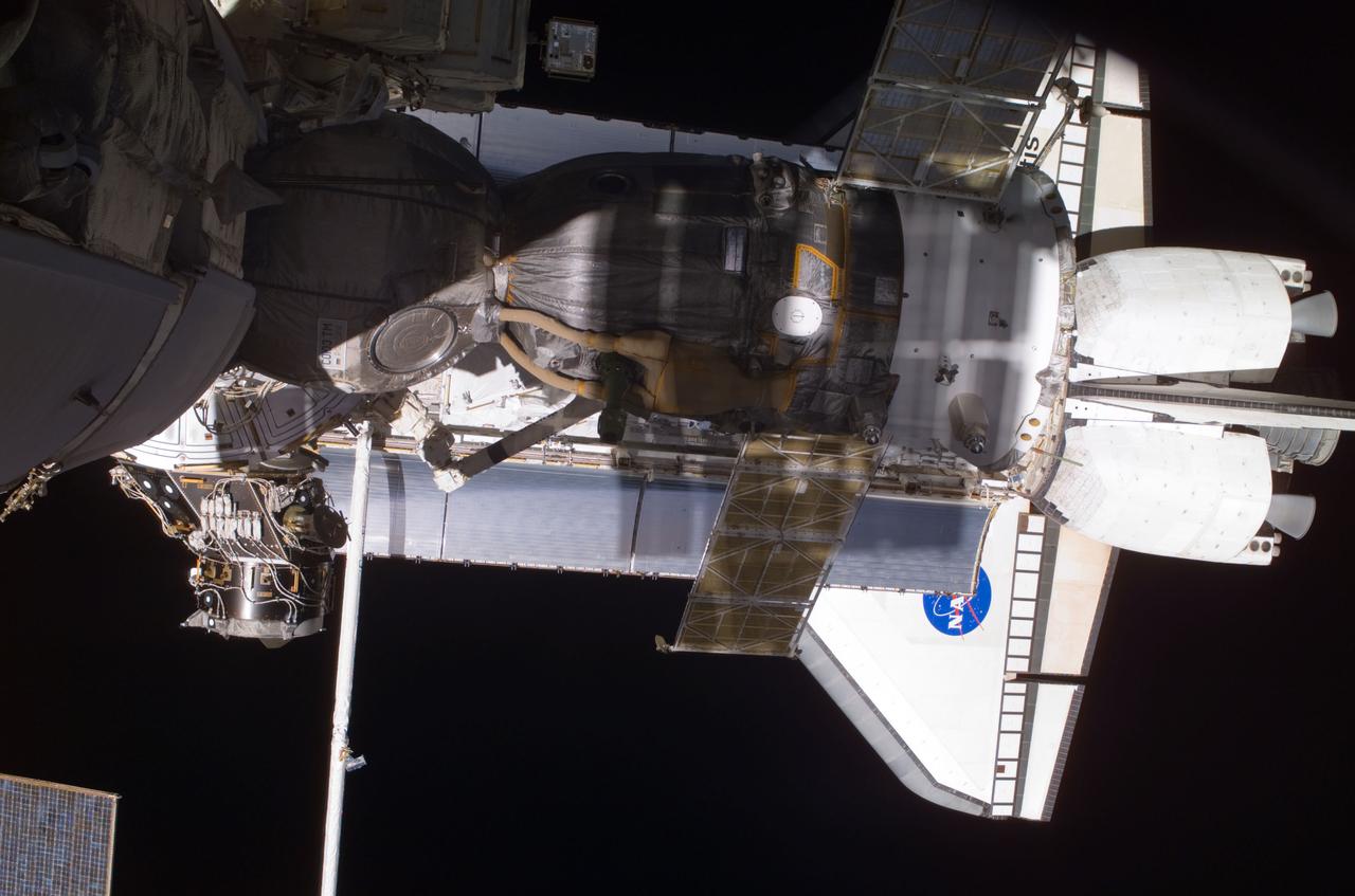 View of the Soyuz and Atlantis' payload bay taken during STS-110's visit to the ISS