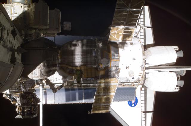 View of the Soyuz and Atlantis' payload bay taken during STS-110's visit to the ISS
