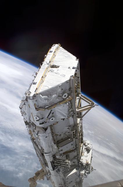 NASA image: View of the S0 Truss being moved into installation position by the SSRMS during STS-110