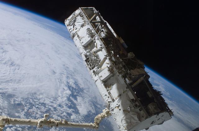 NASA image: View of the S0 Truss being moved into installation position by the SSRMS during STS-110