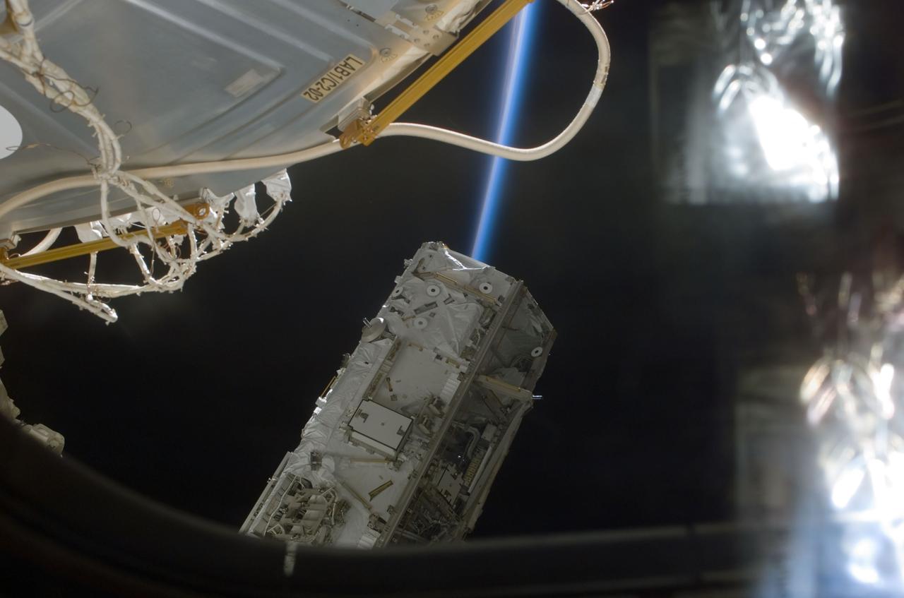 STS110-E-5180 (11 April 2002) --- Backdropped by the blackness of space, the S0 (S-Zero) Truss is moved from the Space Shuttle Atlantis&#0146; cargo bay. Astronauts Ellen Ochoa, STS-110 mission specialist, and Daniel W. Bursch, Expedition Four flight engineer, used the International Space Station&#0146;s (ISS) Canadarm2 to lift the S0 Truss out of the orbiter&#0146;s payload bay and install it onto the temporary claw fixture on the Destiny laboratory. The image was taken with a digital still camera.