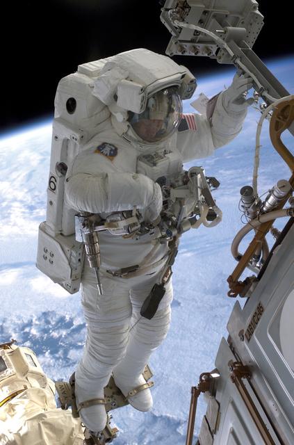 NASA image: MS Sellers connects cables during EVA 2