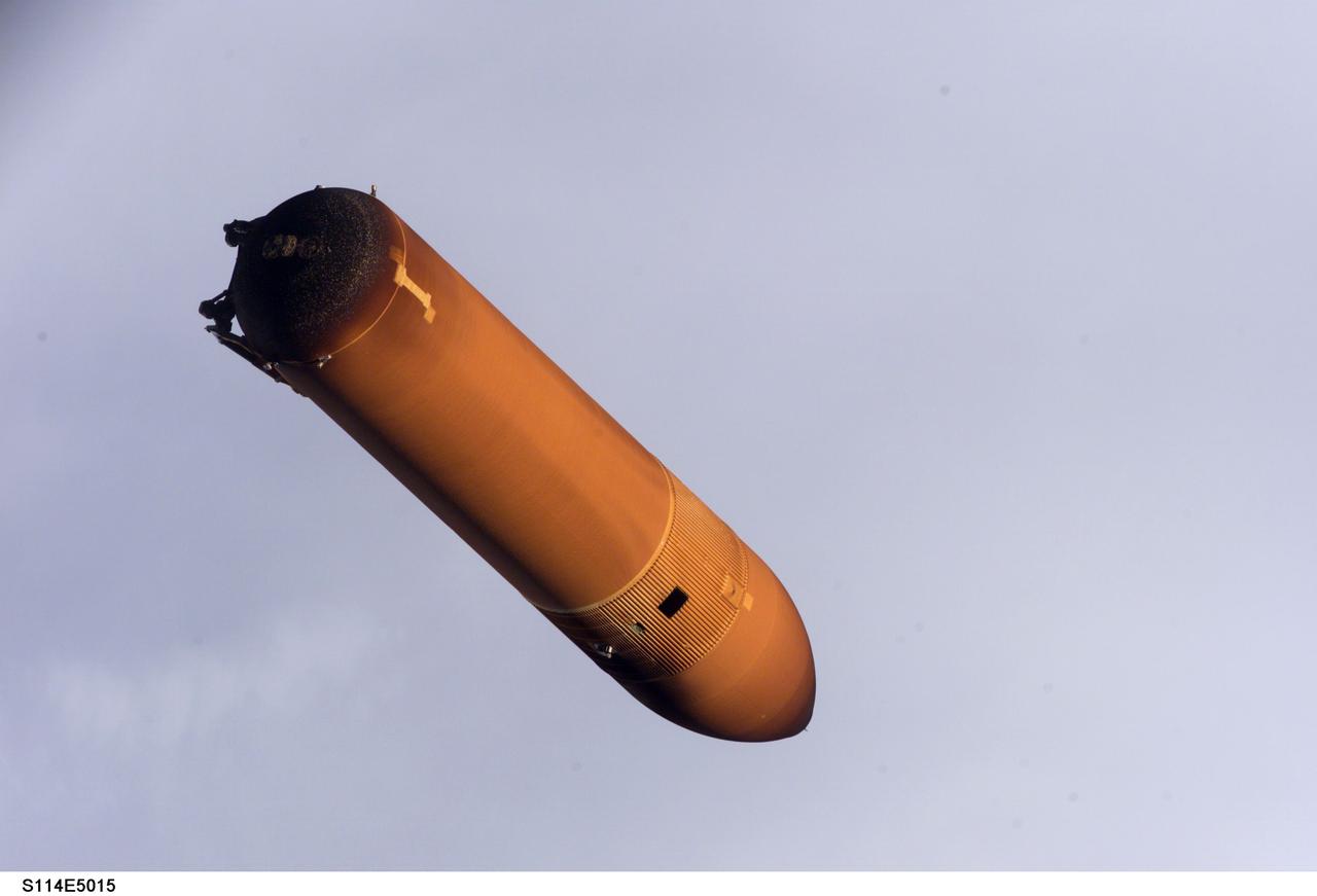 STS114-E-5015 (26 July 2005) ---- Handheld still images taken by Discovery's crew of the external fuel tank as it was jettisoned after launch on July 26 were transmitted to the ground early July 27. Engineers are analyzing these photos as part of the extensive imagery data being gathered to understand debris during the Shuttle's ascent during STS-114. These images of the external tank were taken with the tank closer to the Shuttle than on any past missions due to an earlier maneuver performed by the spacecraft shortly after main engine cutoff.