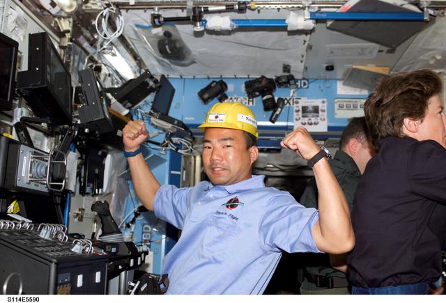 NASA image: Noguchi in Destiny laboratory module wearing yellow hard hat