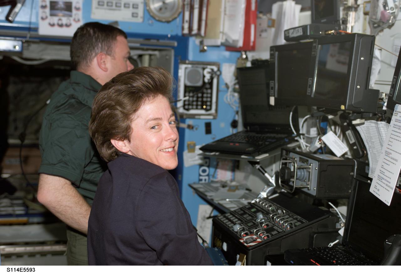 S114-E-5593 (29 July 2005) --- Raffaello was unberthed from Discovery's cargo bay just before 1 a.m. CDT Friday by the Station's Canadarm2, operated by astronauts Wendy Lawrence, STS-114 mission specialist, and James M. Kelly, pilot, and attached to the Station's Unity Node. Hatches were opened a little after 10 a.m. Transfer of its cargo to the Station began soon thereafter. Astronauts Stephen K. Robinson and Soichi Noguchi of JAXA, both mission specialists and both out of frame here, had donned gag hard hats to represent the moving chores that lay ahead once Raffaello was opened. Those two were to exchange their hardhats for EVA suits in less than 24 hours to support the first  scheduled spacewalk for STS-114.