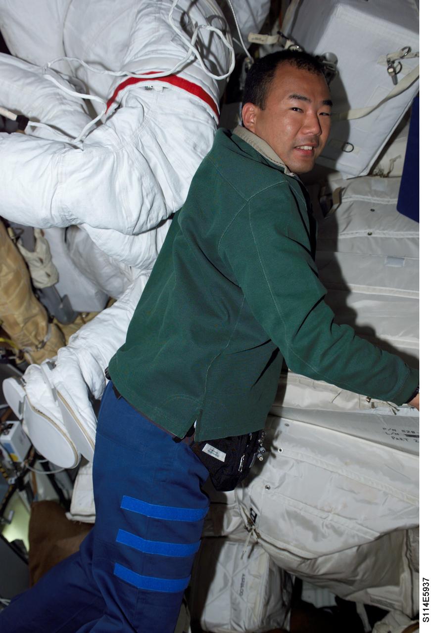 S114-E-5937 (30 July 2005) --- Japanese Aerospace Agency astronaut Soichi Noguchi has changed into clothing more suitable for indoor transfer work after spending six-plus hours outside Space Shuttle Discovery on a spacewalk with astronaut Stephen K. Robinson (out of frame).