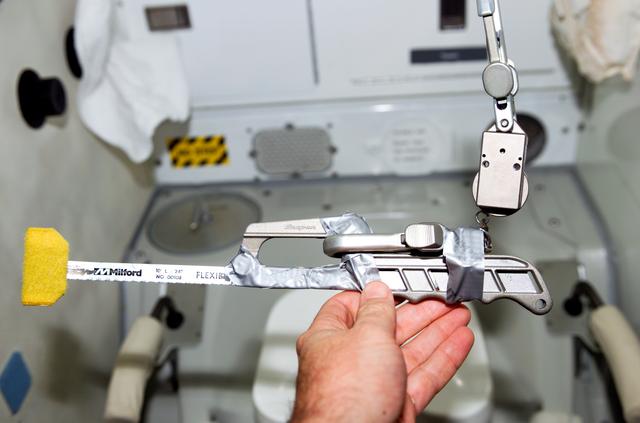NASA image: Modifications made to a hacksaw for use on EVA 3