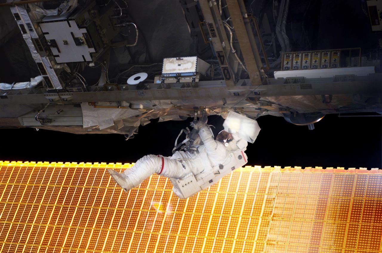 S114-E-6062 (30 July 2005) --- Astronaut Soichi Noguchi, STS-114 mission specialist representing Japan Aerospace Exploration Agency (JAXA), participates in the mission&#0146;s first scheduled session of extravehicular activity (EVA). Noguchi and crewmate Stephen K. Robinson (out of frame) completed a demonstration of Shuttle thermal protection repair techniques and enhancements to the International Space Station&#0146;s attitude control system during the successful 6-hour, 50-minute spacewalk.