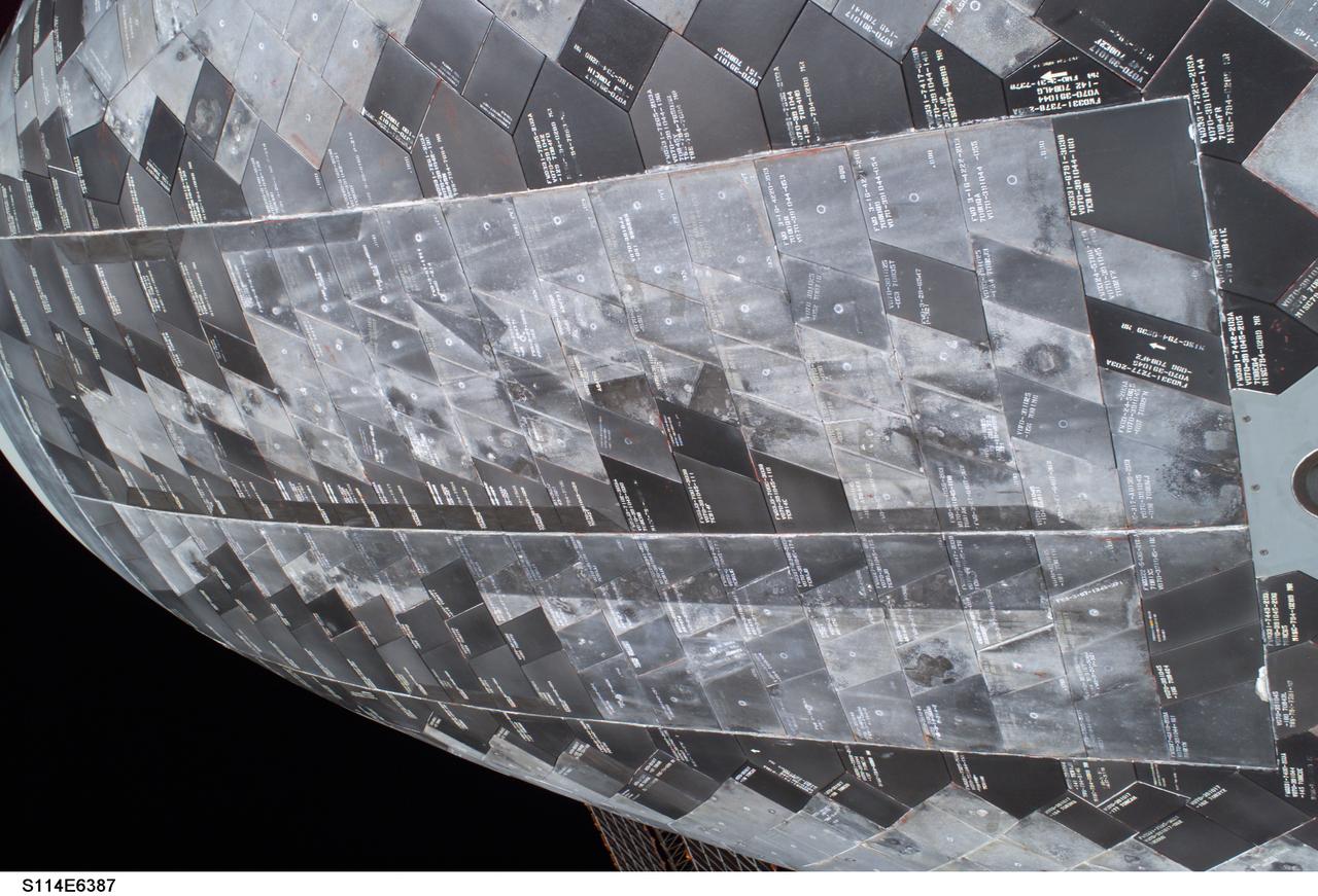 S114-E-6387 (3 August 2005) --- A close-up view of a portion of the thermal protection tiles on Space Shuttle Discovery&#0146;s underside is featured in this image photographed by astronaut Stephen K. Robinson, STS-114 mission specialist, during the mission&#0146;s third session of extravehicular activities (EVA).