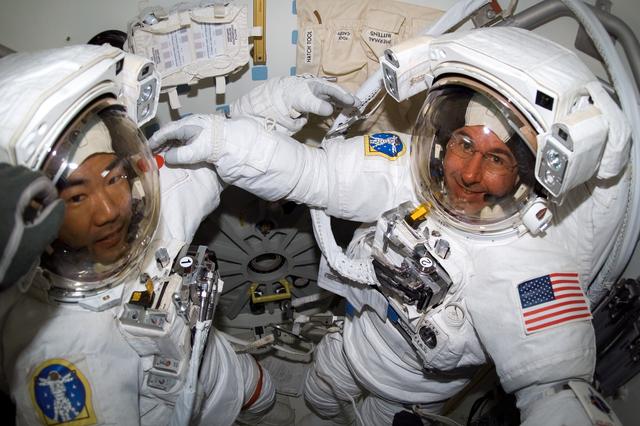 NASA image: Noguchi and Robinson in Airlock