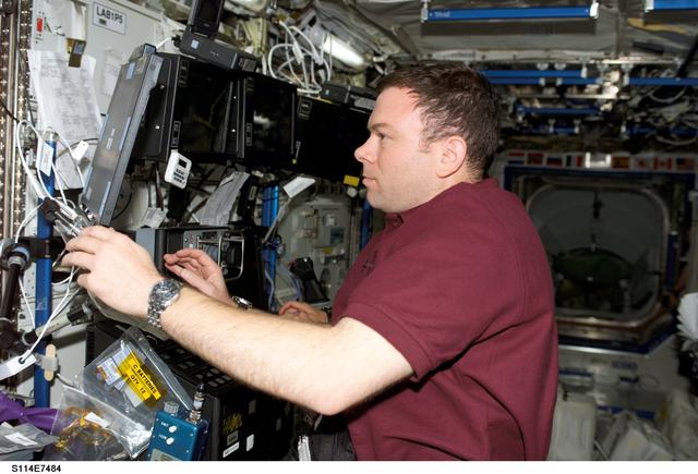 NASA image: Kelly at SSRMS controls in Destiny laboratory module