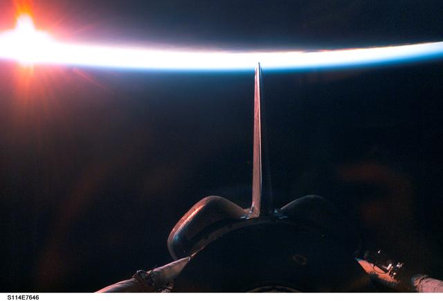 NASA image: Dark sunrise over payload bay