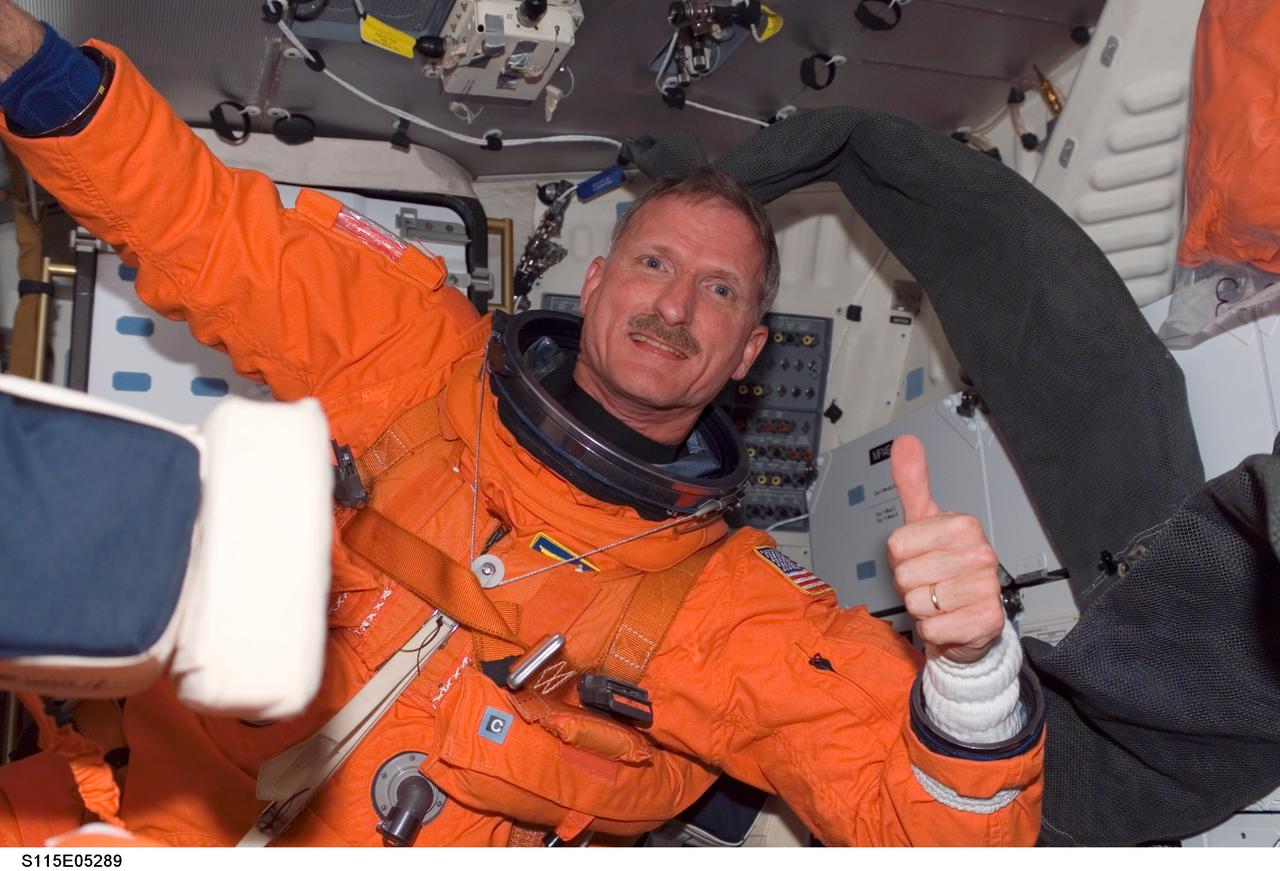 S115-E-05289 (9 Sept. 2006) --- Astronaut Joseph R. Tanner, STS-115 mission specialist,  on mid deck of Atlantis before doffing his launch and entry suit.