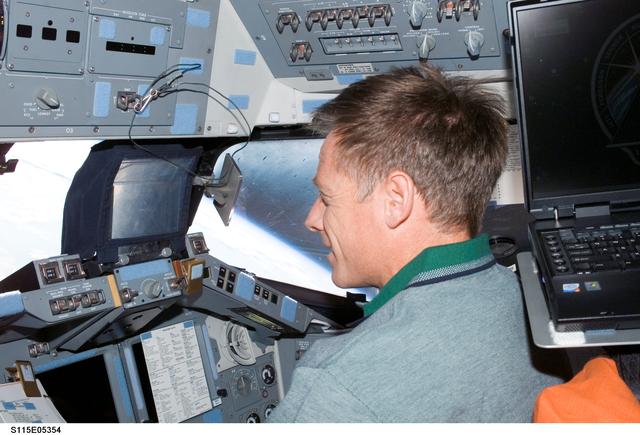 NASA image: STS-115 Pilot Ferguson on the FD of the Space Shuttle Atlantis as it approaches the ISS