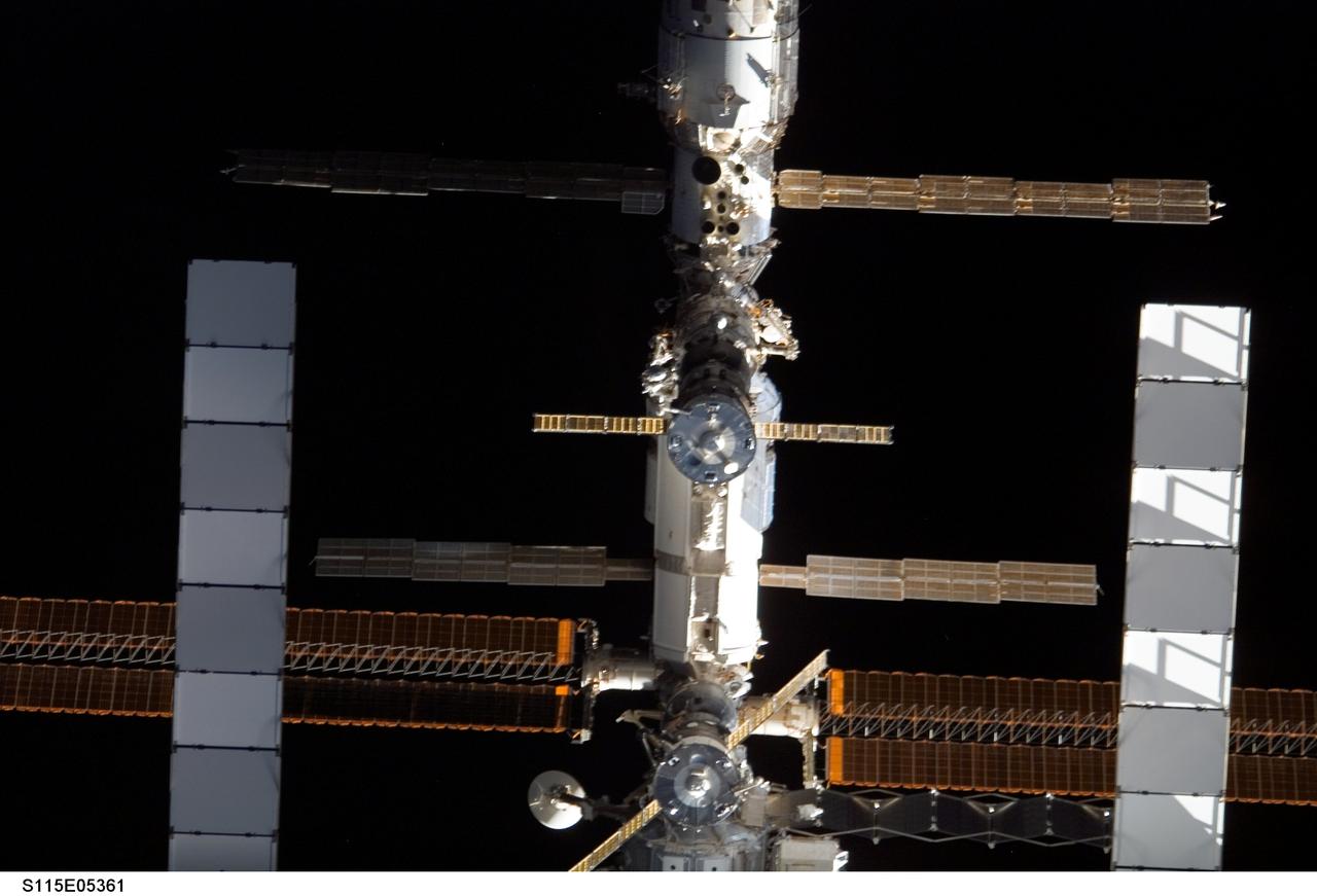 S115-E-05461 (11 Sept. 2006) --- The International Space Station, as seen from the Space Shuttle Atlantis as the two spacecraft prepare for docking, allowing STS-115 astronauts and the Expedition 13 crew to team up for several days of key tasks in space.