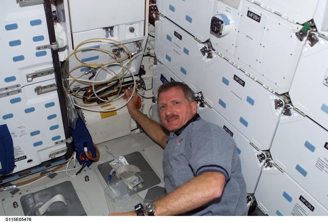 NASA image: Tanner in the meal preparation area of the FWD MDDK on Space Shuttle Atlantis