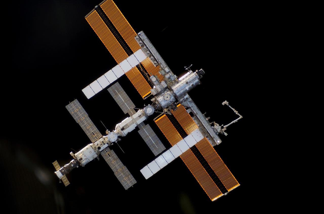 S115-E-05493 (11 Sept. 2006) --- One of the STS-115 crewmembers aboard the Space Shuttle Atlantis took this picture of the International Space Station prior to the docking of the two spacecraft. The subsequent link-up will allow the STS-115 astronauts and the ISS Expedition 13 crew to team up for several days of key tasks in space.