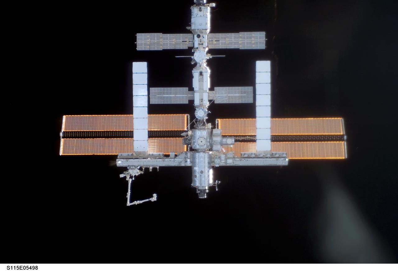 S115-E-05498 (11 Sept. 2006) --- One of the STS-115 crewmembers aboard the Space Shuttle Atlantis took this picture of the International Space Station prior to the docking of the two spacecraft. The subsequent link-up will allow the STS-115 astronauts and the ISS Expedition 13 crew to team up for several days of key tasks in space.