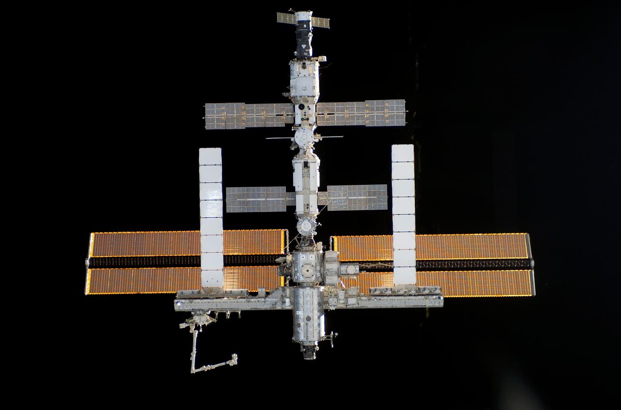 S115-E-05499 (11 Sept. 2006) --- One of the STS-115 crewmembers aboard the Space Shuttle Atlantis took this picture of the International Space Station prior to the docking of the two spacecraft. The subsequent link-up will allow the STS-115 astronauts and the ISS Expedition 13 crew to team up for several days of key tasks in space.