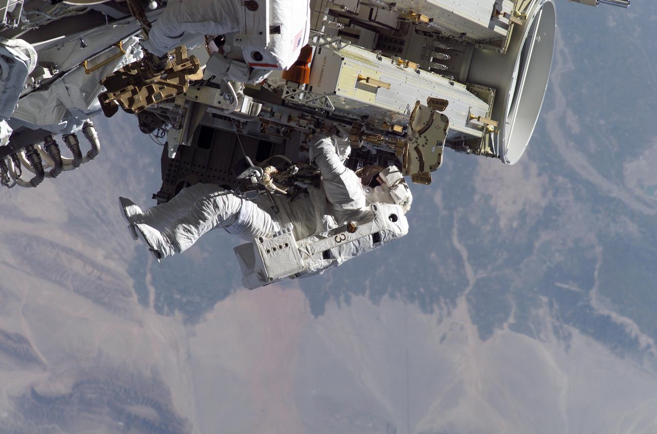 S115-E-05623 (12 Sept. 2006) --- Astronaut Heidemarie M. Stefanyshyn-Piper, STS-115 mission specialist, releases the restraints on the forward Solar Array Blanket Box (SABB) during the Sept. 12 spacewalk, which she shared with astronaut Joseph R. Tanner, partially visible at top edge of frame. The two participated in the first of three scheduled STS-115 extravehicular activity (EVA) sessions as the Atlantis astronauts and the Expedition 13 crew members join efforts this week to resume construction of the International Space Station.
