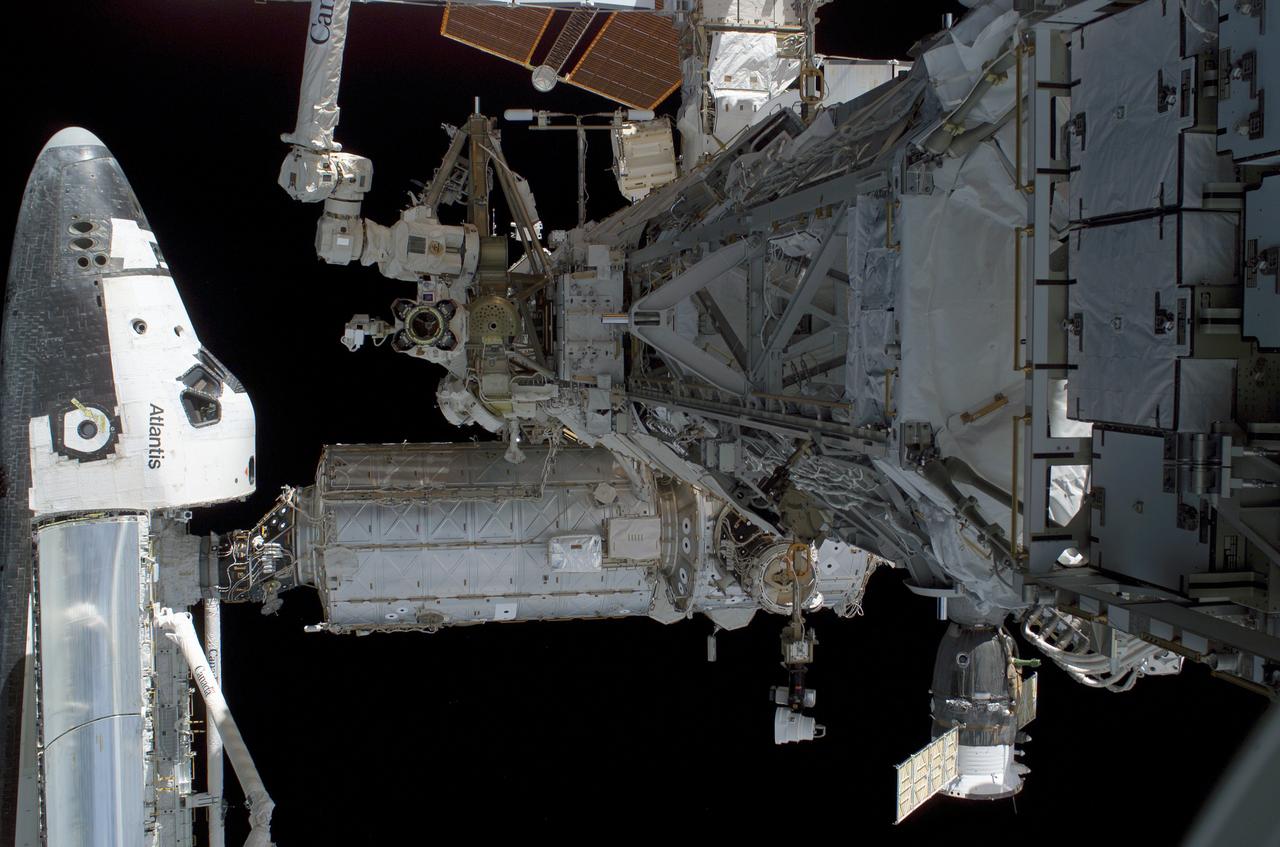 S115-E-05689 (12 Sept. 2006) --- Although no astronauts are visible in this picture, action was brisk outside the space shuttle/space station tandem when this digital still image was recorded on Sept. 12. Astronauts Joseph R. Tanner and Heidemarie M. Stefanyshyn-Piper participated in the first of three scheduled STS-115 extravehicular activity (EVA) sessions as the Atlantis astronauts and the Expedition 13 crewmembers join efforts this week to resume construction of the International Space Station.