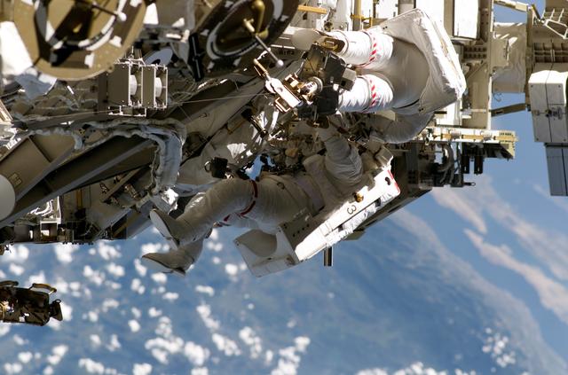 NASA image: STS-115 MS Burbank and MacLean prepare the SARJ on the P3 - P4 Truss Segment during EVA