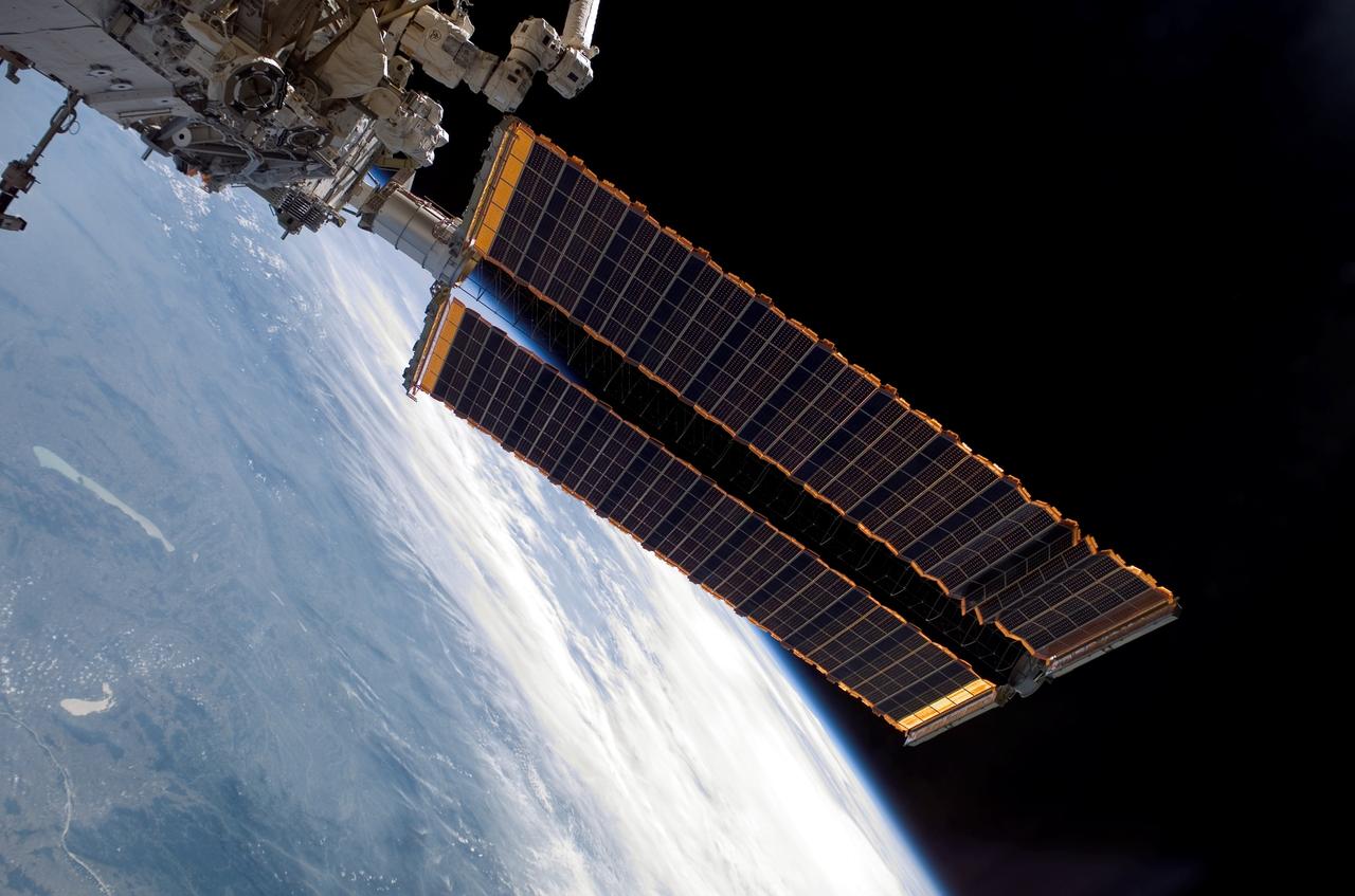 S115-E-05996 (14 Sept. 2006) --- Space Shuttle Atlantis astronauts spread a second set of wings for the International Space Station today. The new solar arrays were fully extended at 7:44 a.m. (CDT). The new arrays span a total of 240 feet and have a width of 38 feet. They are attached to the station's newest component, the P3/P4 integrated truss segment. The installation of the P3/P4, which occurred Tuesday and the deployment of the arrays set the stage for future expansion of the station.