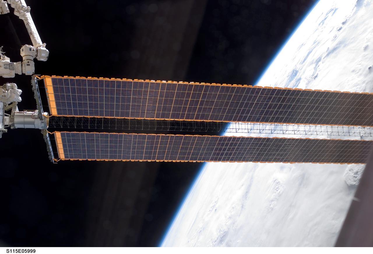 S115-E-05999  (14 Sept. 2006) --- Space Shuttle Atlantis astronauts spread a second set of wings for the International Space Station today. The new solar arrays were fully extended at 7:44 a.m   CDT.  The new arrays span a total of 240 feet and have a width of 38 feet. They are attached to the station's newest component, the P3/P4 integrated truss segment. The installation of the P3/P4, which occurred Tuesday,  and the deployment of the arrays set the stage for future expansion of the station.