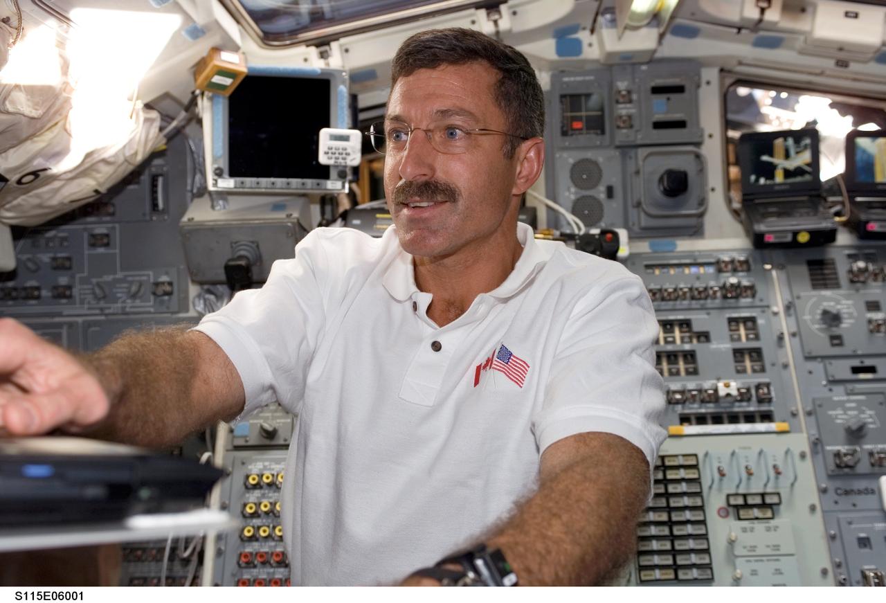 S115-E-06001 (14 Sept. 2006) --- Astronaut Daniel C. Burbank, STS-115 mission specialist, works on the aft flight deck of the Space Shuttle Atlantis during the sixth day in space for the  shuttle crew.