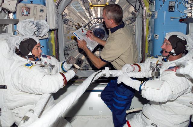 NASA image: STS-115 MS Stefanyshyn-Piper is wearing her EMU in the Quest A/L on the ISS