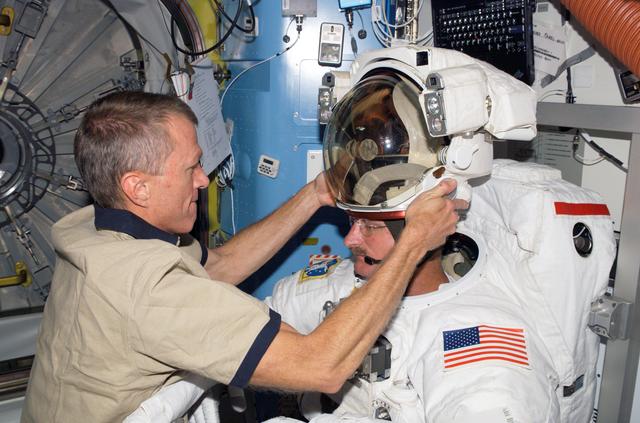 NASA image: STS-115 MS Stefanyshyn-Piper is wearing her EMU in the Quest Airlock (A/L) of the ISS