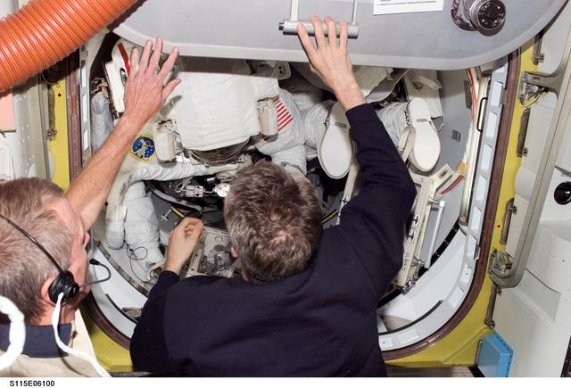 NASA image: Jett and Reiter close the hatch in the Air Lock during Expedition 13 / STS-115 Joint Operations