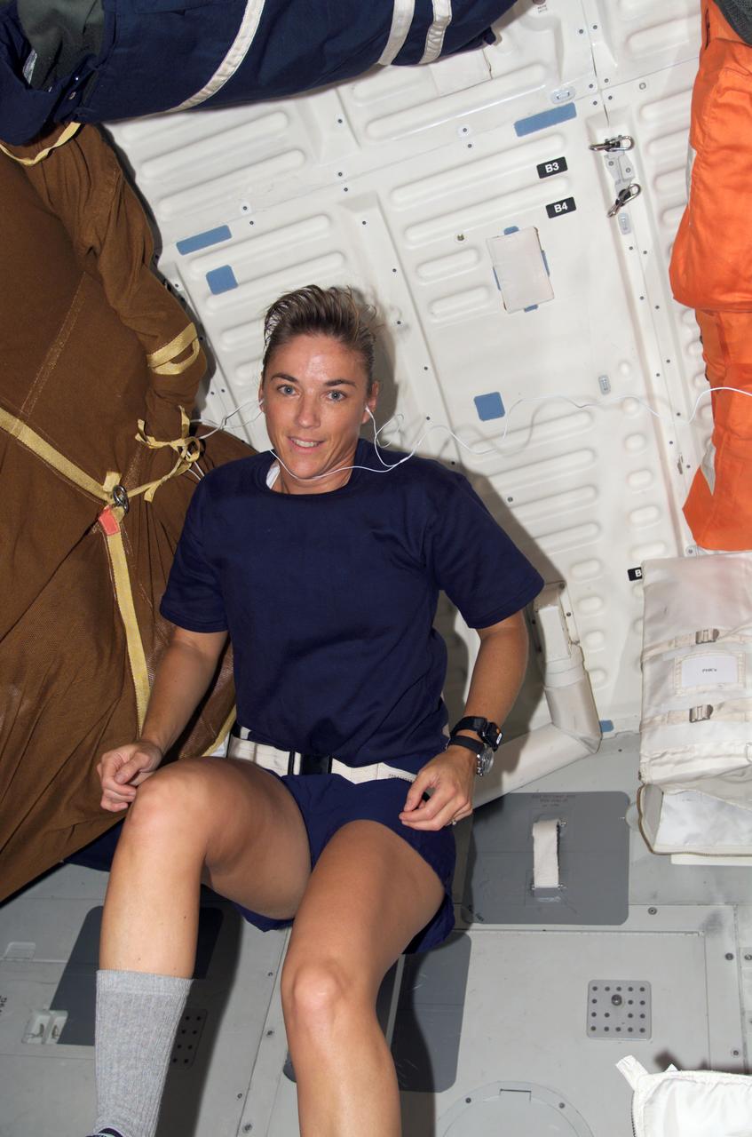 S115-E-06786 (17 Sept. 2006) --- Astronaut Heidemarie M. Stefanyshyn-Piper, STS-115 mission specialist, works out on a bicycle ergometer on the middeck of the Space Shuttle Atlantis.