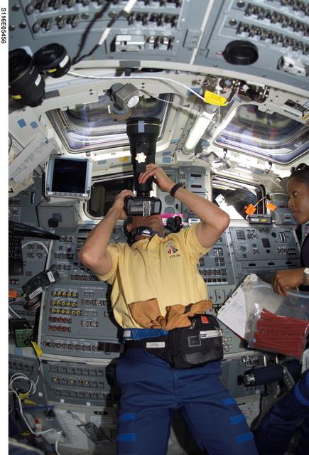 NASA image: STS-116 Fuglesang uses Night Scope Assembly in the aft FD on Space Shuttle Discovery