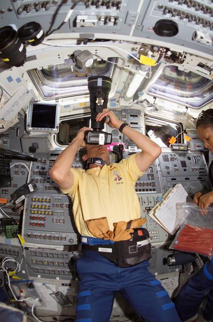 NASA image: STS-116 Fuglesang uses Night Scope Assembly in the aft FD on Space Shuttle Discovery