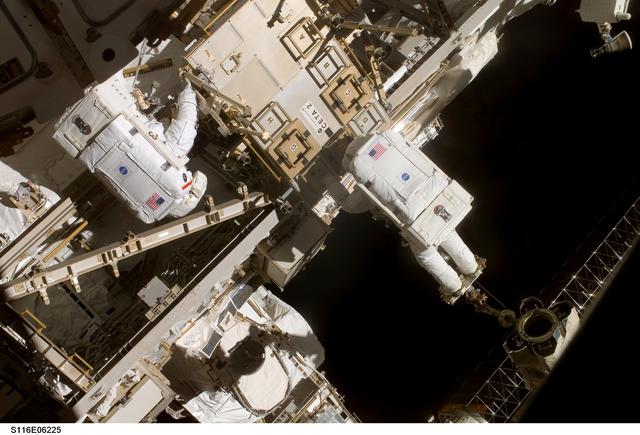NASA image: STS-116 MS Fuglesang and Curbeam, Jr., working on CETA 2 cart on EVA 2