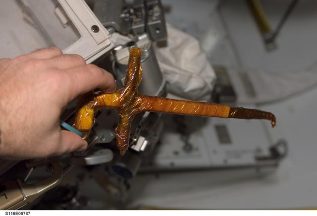 NASA image: EMU Tool in the A/L taken during Joint Operations