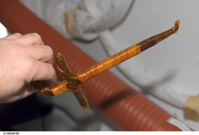 NASA image: EMU Tool in the A/L taken during Joint Operations