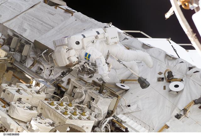 NASA image: STS-116 MS Fuglesang works on the UMA on the STBD side of the S0 Truss during EVA 4