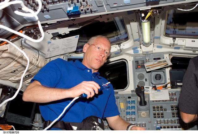 NASA image: Forrester uses communication equipment in the aft FD of STS-117 Space Shuttle Atlantis