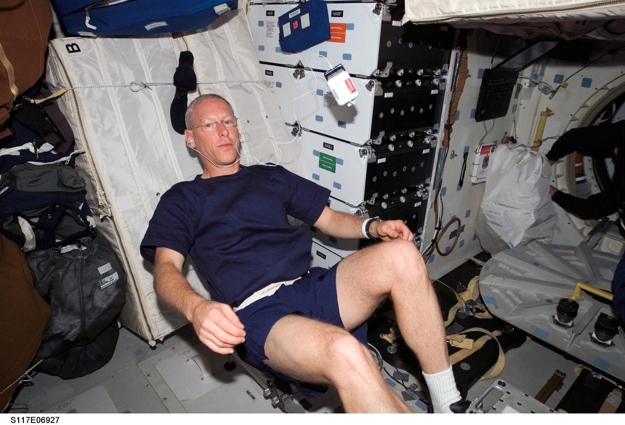 S117-E-06927 (10 June 2007) --- Astronaut Patrick Forrester, STS-117 mission specialist, exercises on a bicycle ergometer on the middeck of the Space Shuttle Atlantis.