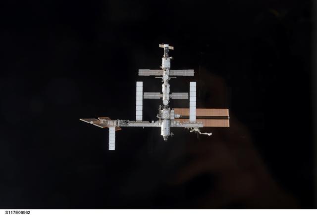 NASA image: ISS during rendezvous and docking of STS-117 Space Shuttle Atlantis