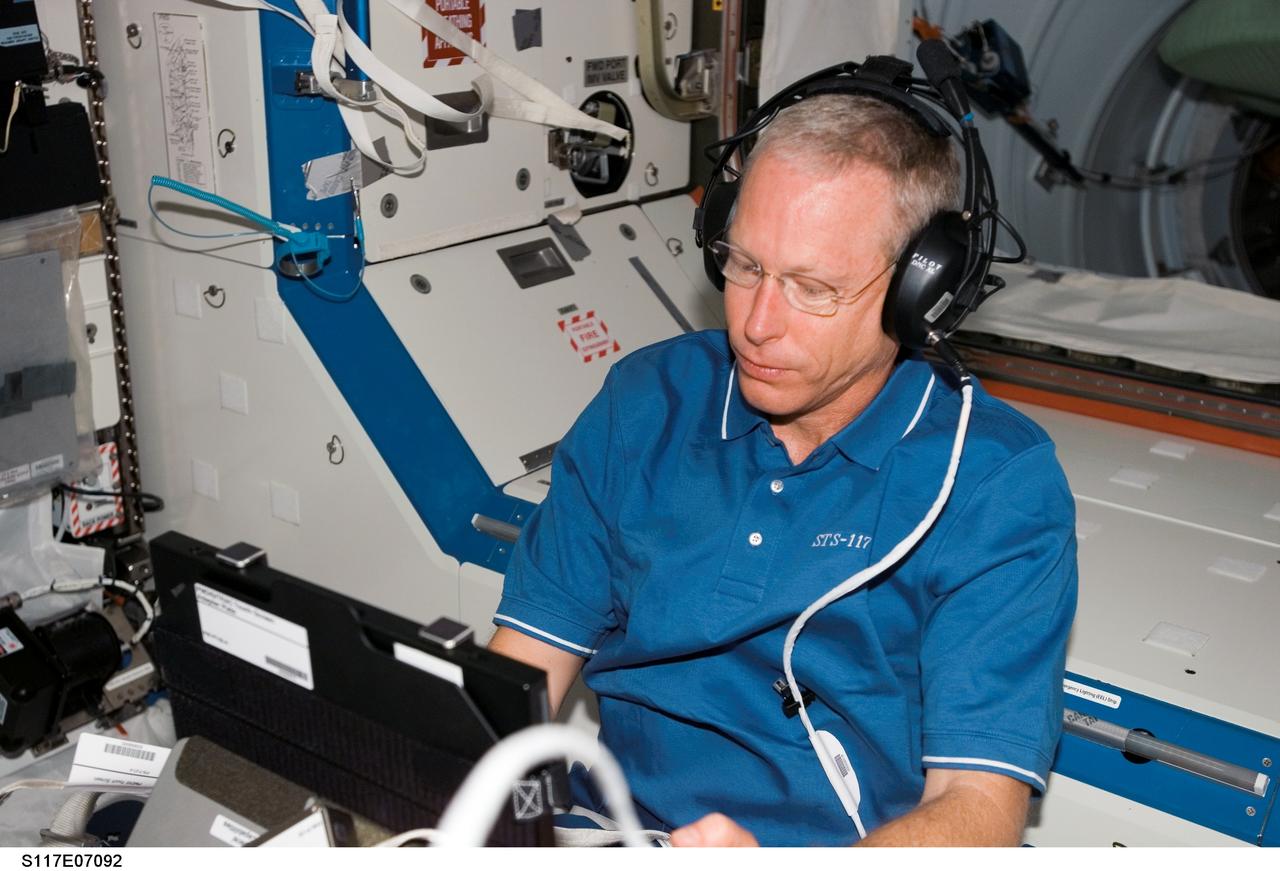 S117-E-07092 (12 June 2007) --- Astronaut Patrick Forrester, STS-117 mission specialist, works with the Test of Reaction and Adaptation Capabilities (TRAC) experiment in the Destiny laboratory of the International Space Station while Space Shuttle Atlantis was docked with the station. The TRAC investigation will test the theory of brain adaptation during space flight by testing hand-eye coordination before, during and after the space flight.