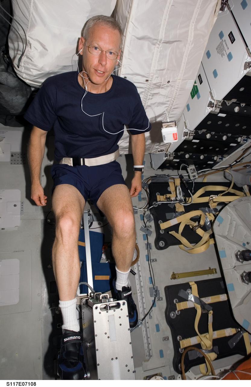 S117-E-07108 (12 June 2007) --- Astronaut Patrick Forrester, STS-117 mission specialist, exercises on a bicycle ergometer on the middeck of the Space Shuttle Atlantis while docked with the International Space Station.