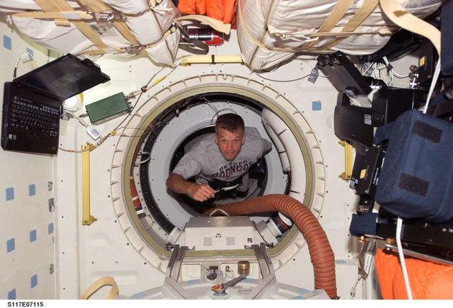 NASA image: Swanson floats through hatch to the MDDK of STS-117 Space Shuttle Atlantis during Joint Operations