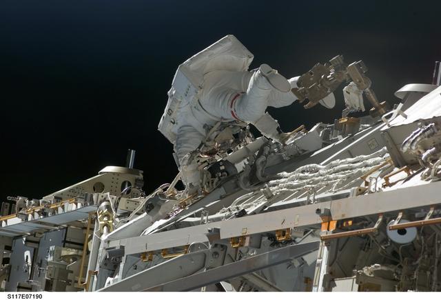 NASA image: Forrester works at the S3/S4 Trusses during EVA 2 on STS-117 Mission