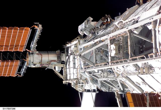 NASA image: Forrester works at the S3/S4 Trusses during EVA 2 on STS-117 Mission