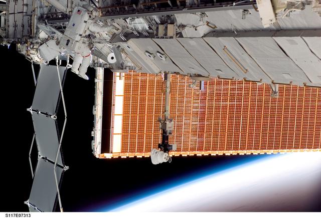 NASA image: Forrester works at the P6 Truss during EVA 2 on STS-117 Mission