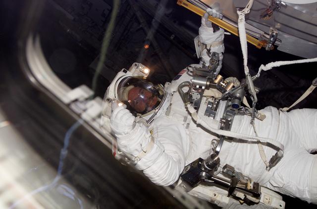 NASA image: Reilly performing EVA 3 from the aft FD window